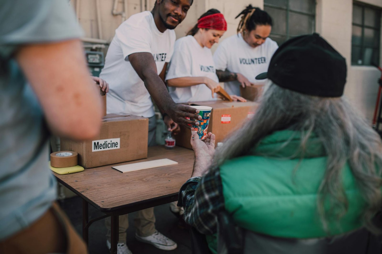 Volunteers distributing aid to community members